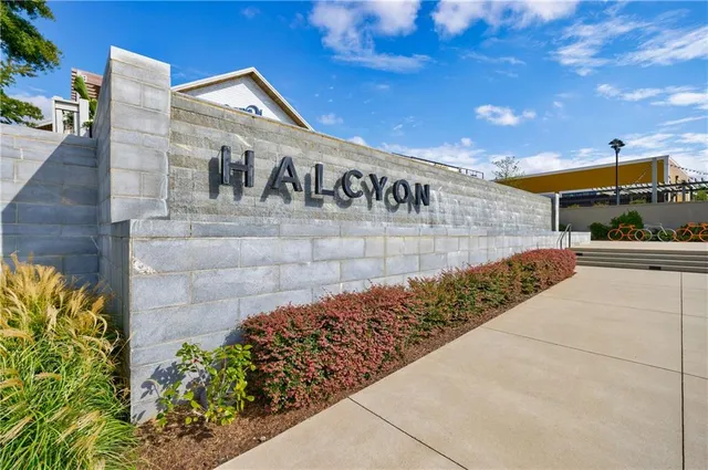 an aerial view of residential houses with outdoor space and swimming pool
