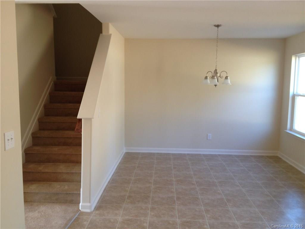 2062 Gunnars Ridge Road, Unit 32 Lancaster, SC 29720 - Photo 2 of 20 wooden floor in an empty room with a window