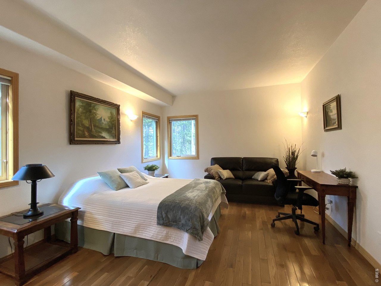 28 Valley View Lane Evergreen, CO 80439 - Photo 18 of 37 a bedroom with two beds and a desk