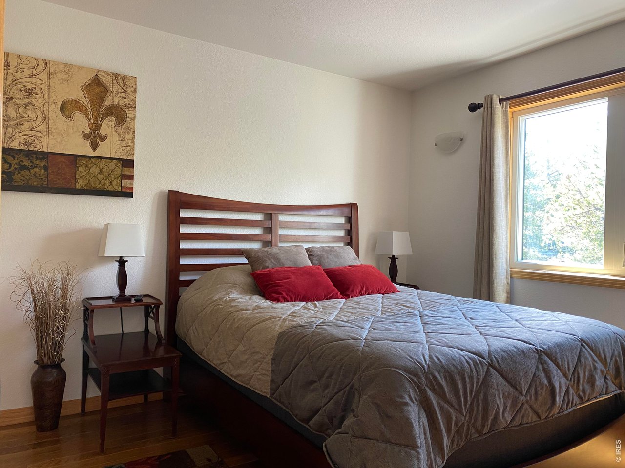 28 Valley View Lane Evergreen, CO 80439 - Photo 19 of 37 a bedroom with a bed and a window
