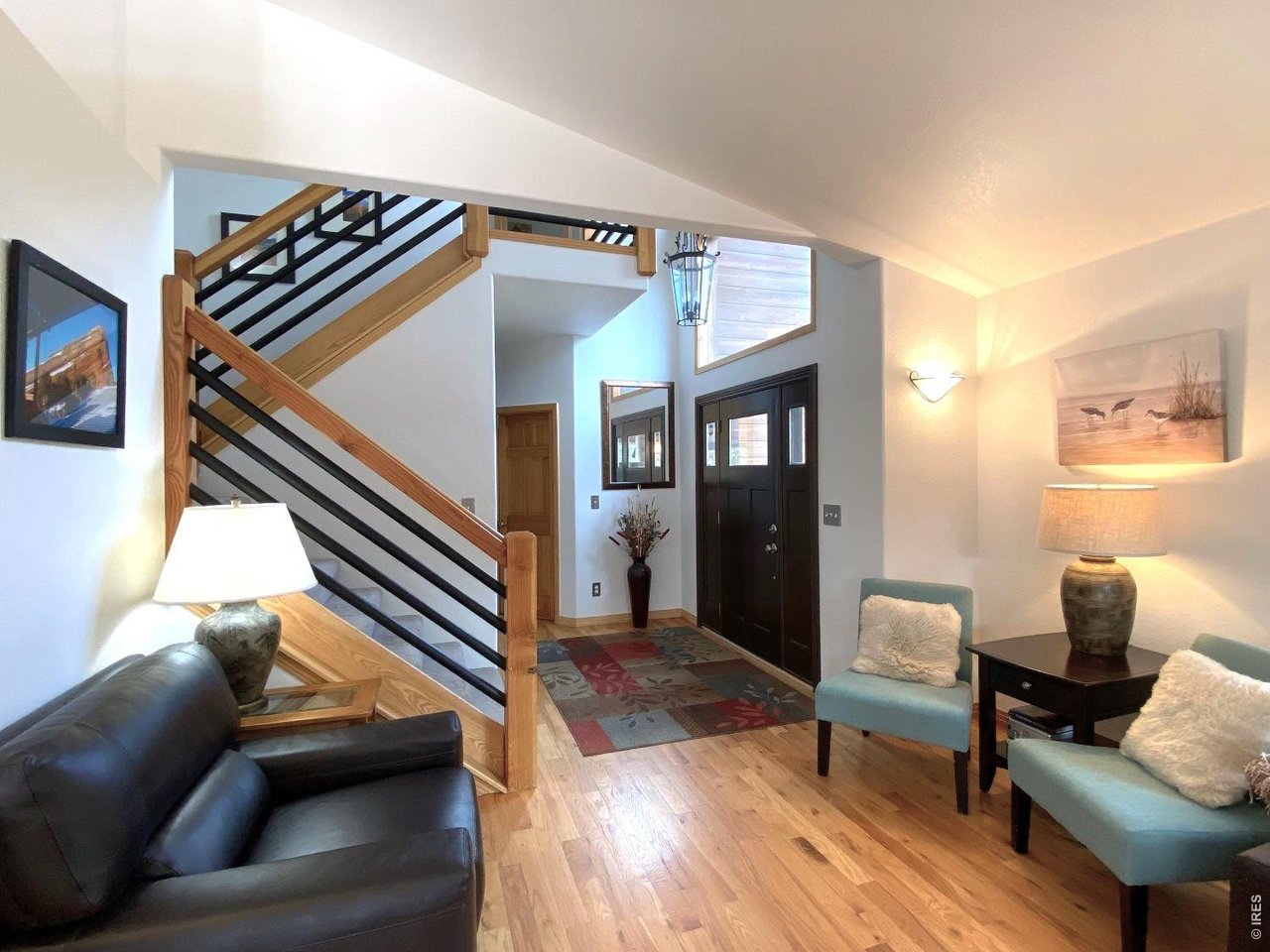 28 Valley View Lane Evergreen, CO 80439 - Photo 4 of 37 a living room with furniture and a wooden floor