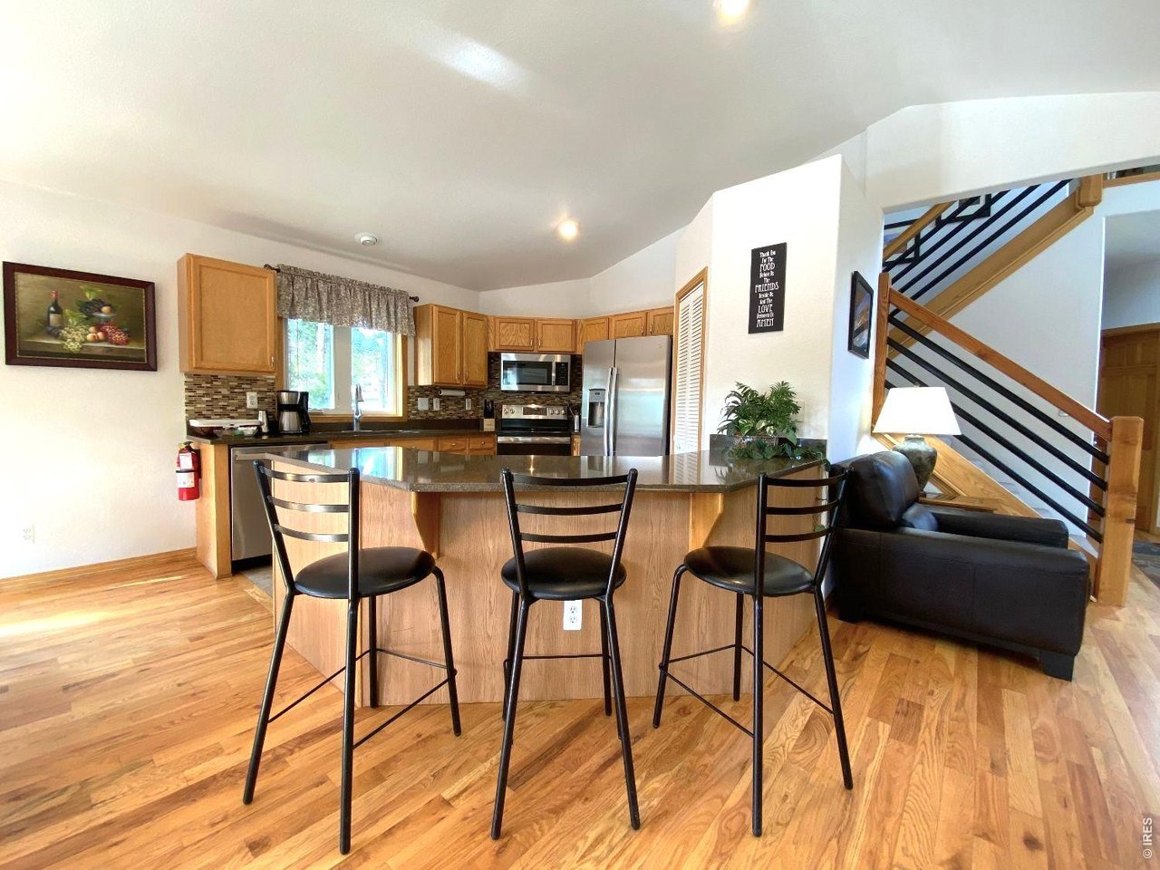 28 Valley View Lane Evergreen, CO 80439 - Photo 5 of 37 a living room with stainless steel appliances kitchen island granite countertop furniture and a kitchen view