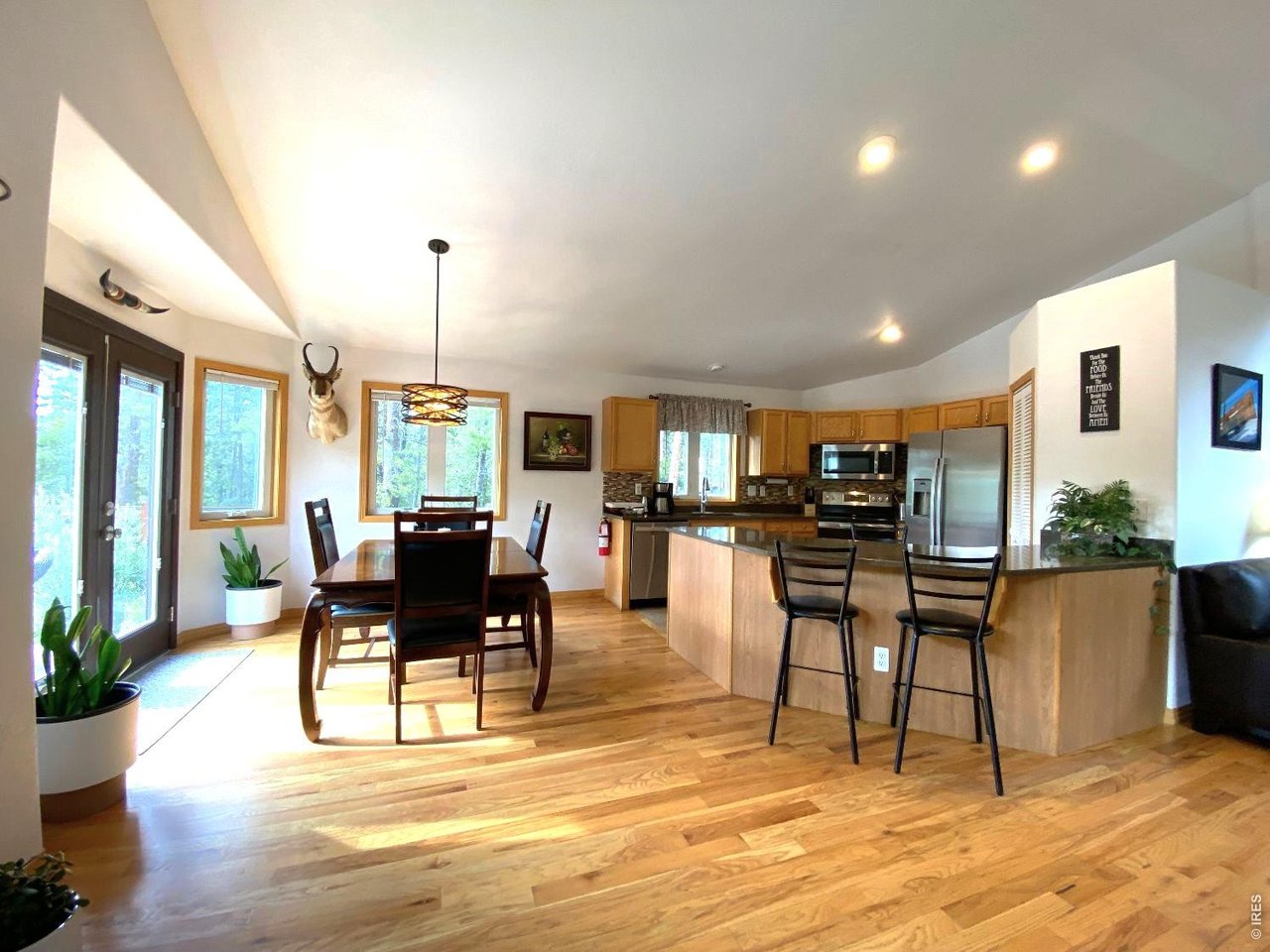 28 Valley View Lane Evergreen, CO 80439 - Photo 6 of 37 a view of a dining room with furniture window and wooden floor