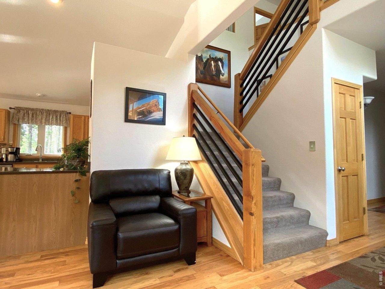 28 Valley View Lane Evergreen, CO 80439 - Photo 9 of 37 a view of entryway and hall with wooden floor