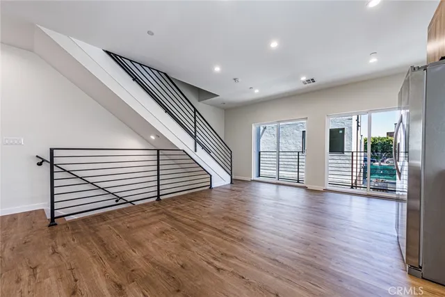 a view of an entryway with wooden floor