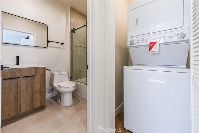 a bathroom with a toilet a sink and bathtub