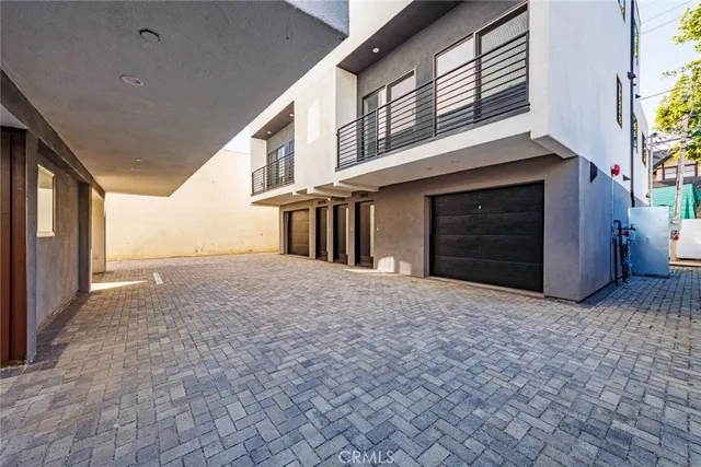 a view of a house with a yard and garage