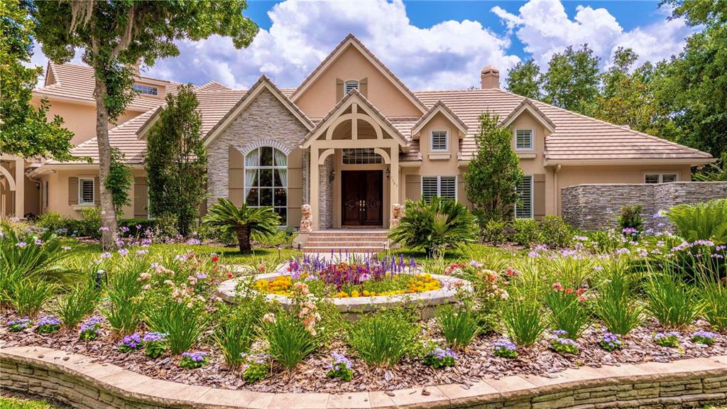 a front view of house with yard and green space