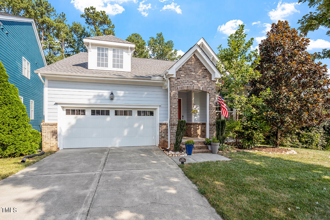 920 Chapanoke Road Raleigh, NC 27603 - Photo 1 of 47 a front view of a house with a yard and trees