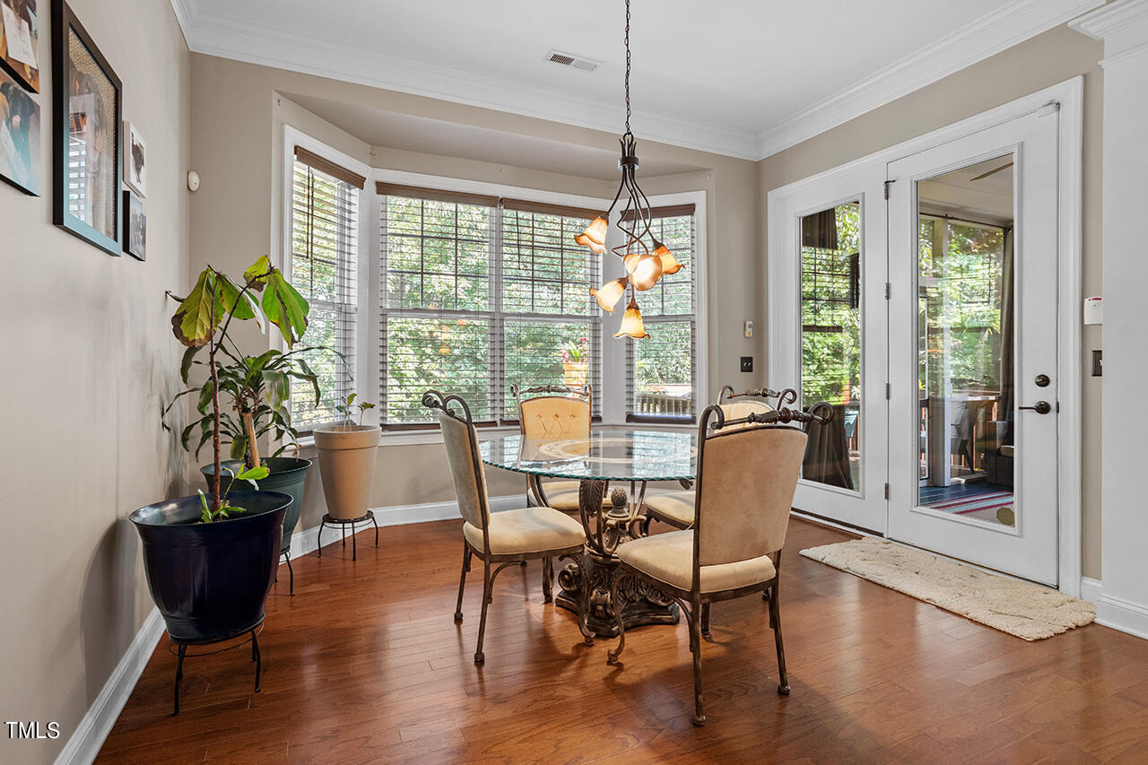 920 Chapanoke Road Raleigh, NC 27603 - Photo 14 of 47 a view of a dining room with furniture window and wooden floor