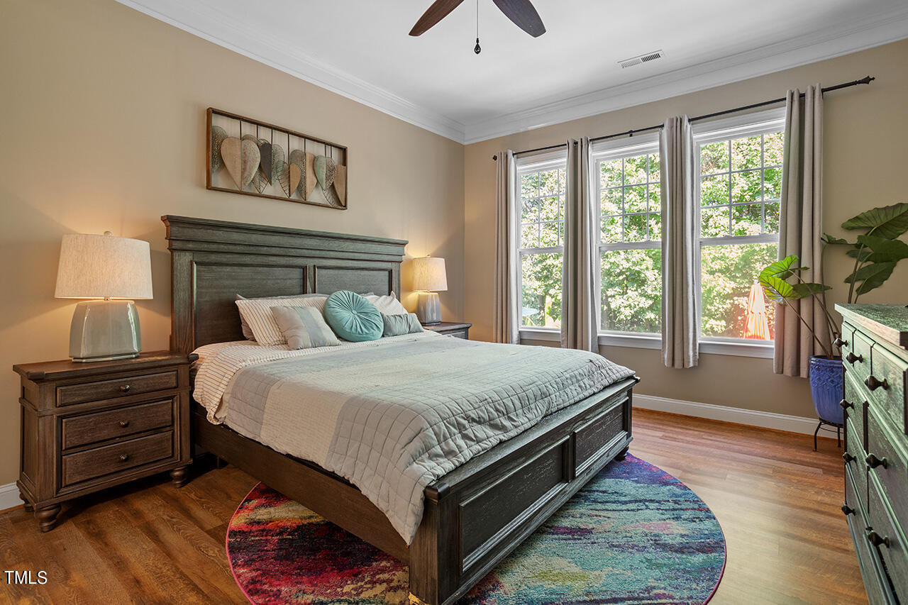 920 Chapanoke Road Raleigh, NC 27603 - Photo 18 of 47 a bedroom with a bed a dresser next to a window