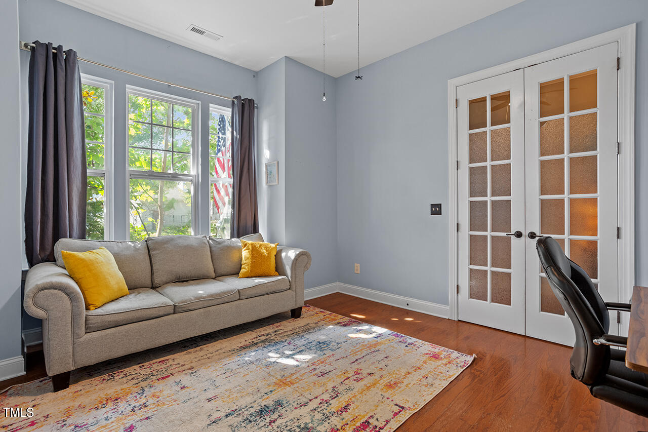 920 Chapanoke Road Raleigh, NC 27603 - Photo 22 of 47 a living room with furniture and a window
