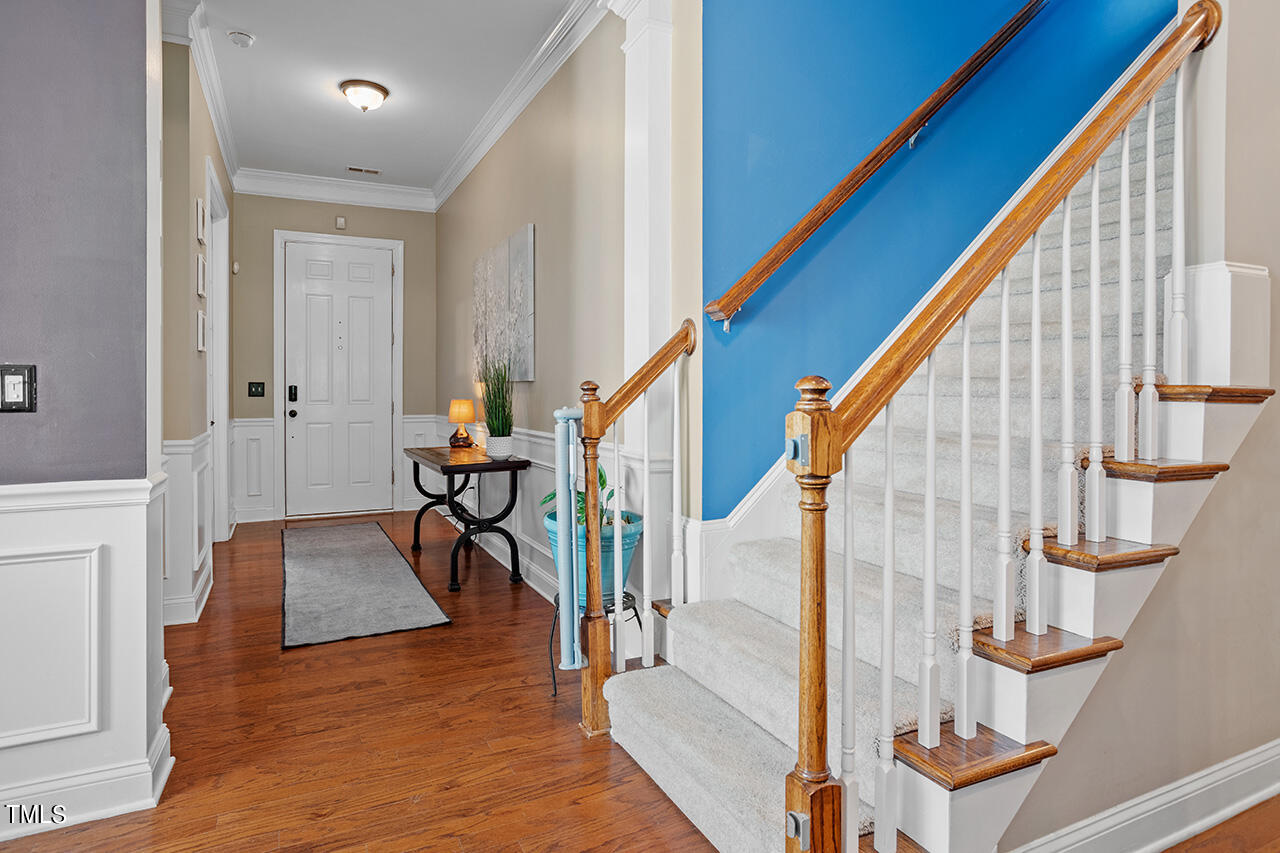 920 Chapanoke Road Raleigh, NC 27603 - Photo 23 of 47 a view of an entryway with wooden floor and staircase