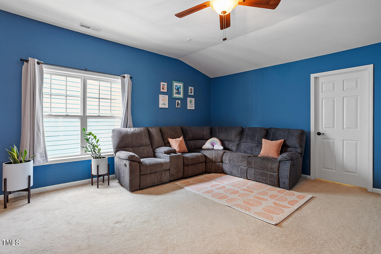 920 Chapanoke Road Raleigh, NC 27603 - Photo 24 of 47 a living room with furniture and a window