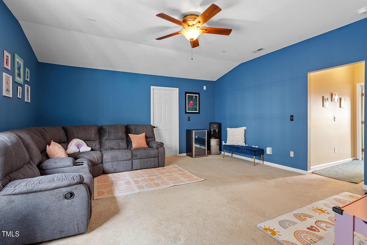 920 Chapanoke Road Raleigh, NC 27603 - Photo 25 of 47 a bedroom with a bed and a ceiling fan