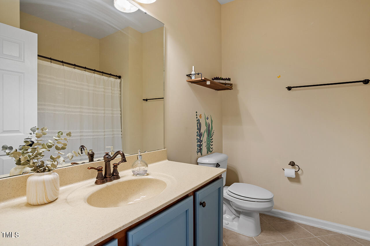 920 Chapanoke Road Raleigh, NC 27603 - Photo 27 of 47 a bathroom with a sink toilet and shower
