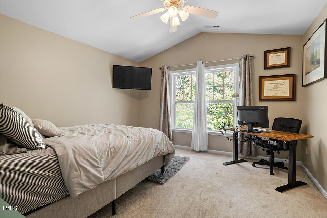 920 Chapanoke Road Raleigh, NC 27603 - Photo 28 of 47 a bed room with a bed and a chair