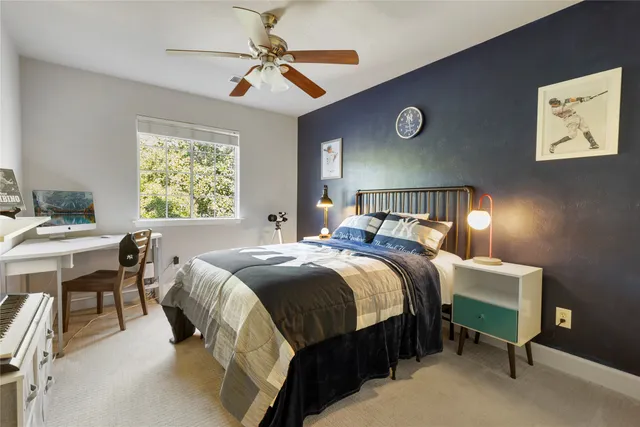 a bedroom with a bed and a table