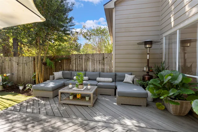 a outdoor space with patio furniture and potted plants