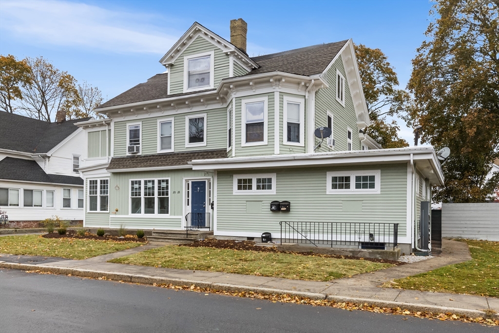 20 Orne Street, Unit B North Attleboro, MA 02760 - Photo 1 of 16 a view of a white house with a large windows and a big yard