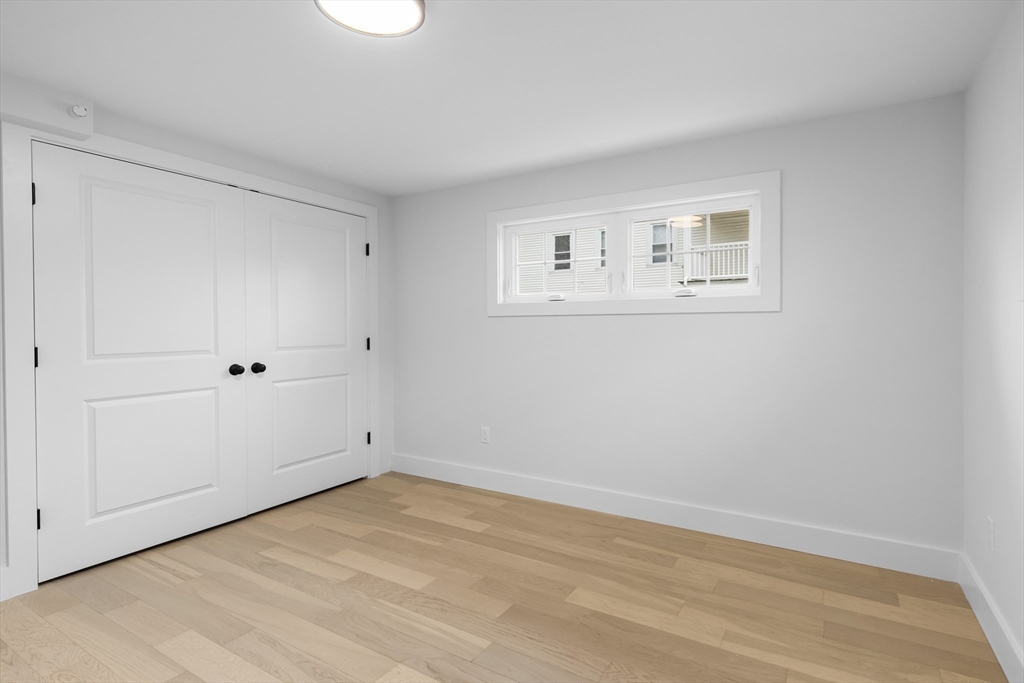 20 Orne Street, Unit B North Attleboro, MA 02760 - Photo 14 of 16 a view of empty room with wooden floor