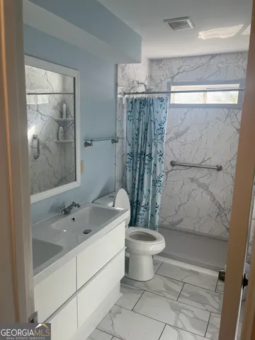 a view of workspace with wooden floor windows