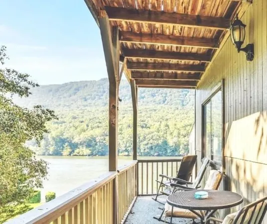a view of a room with furniture and wooden floor