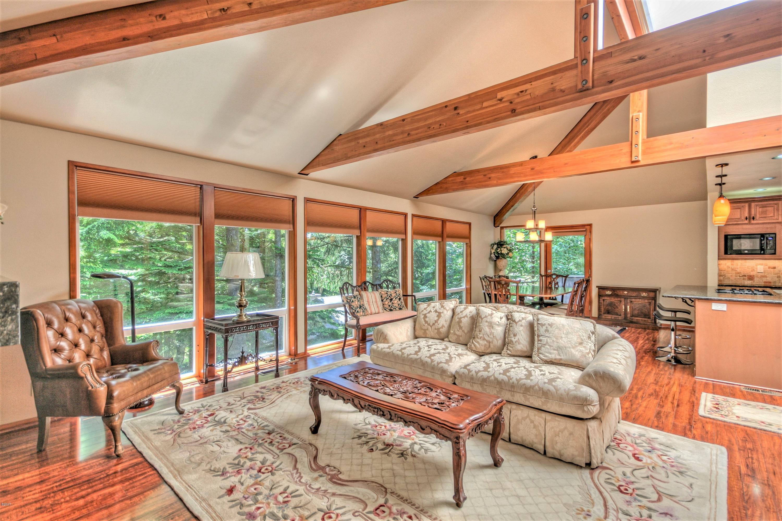 17 Big Tree Road Gleneden Beach, OR 97388 - Photo 7 of 52 a living room with furniture a rug and a large window