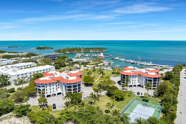 a view of a city with an ocean houses lake and ocean view