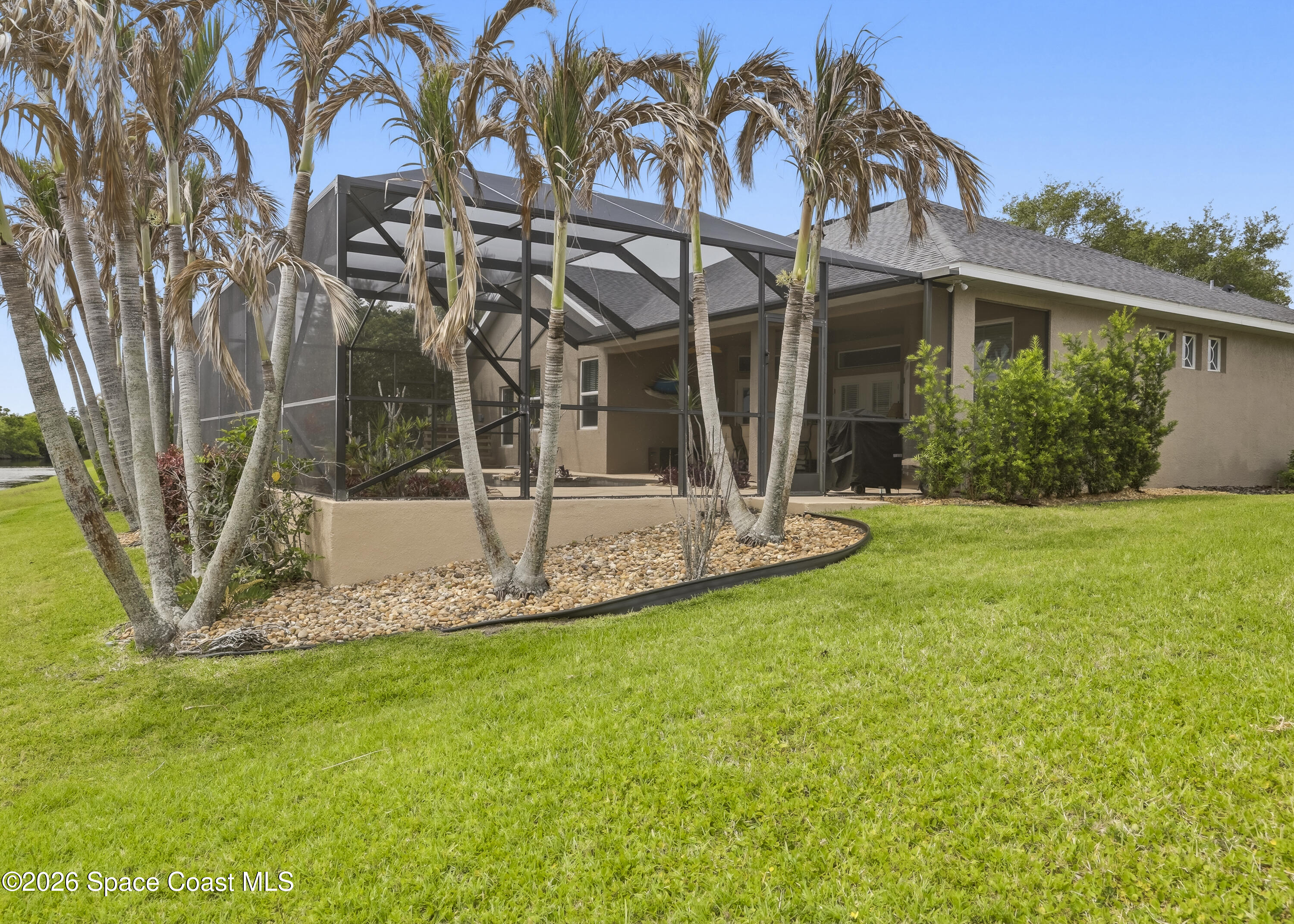 1643 Long Pine Road Melbourne, FL 32940 - Photo 55 of 63 a view of a house with backyard and a tree