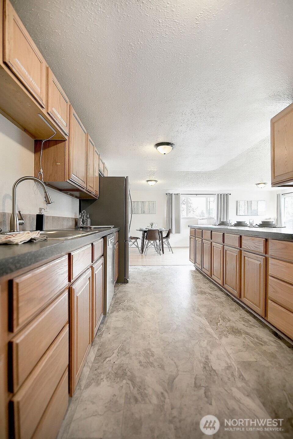 1925 28th Avenue Longview, WA 98632 - Photo 13 of 37 a open kitchen with stainless steel appliances granite countertop a sink stove and cabinets