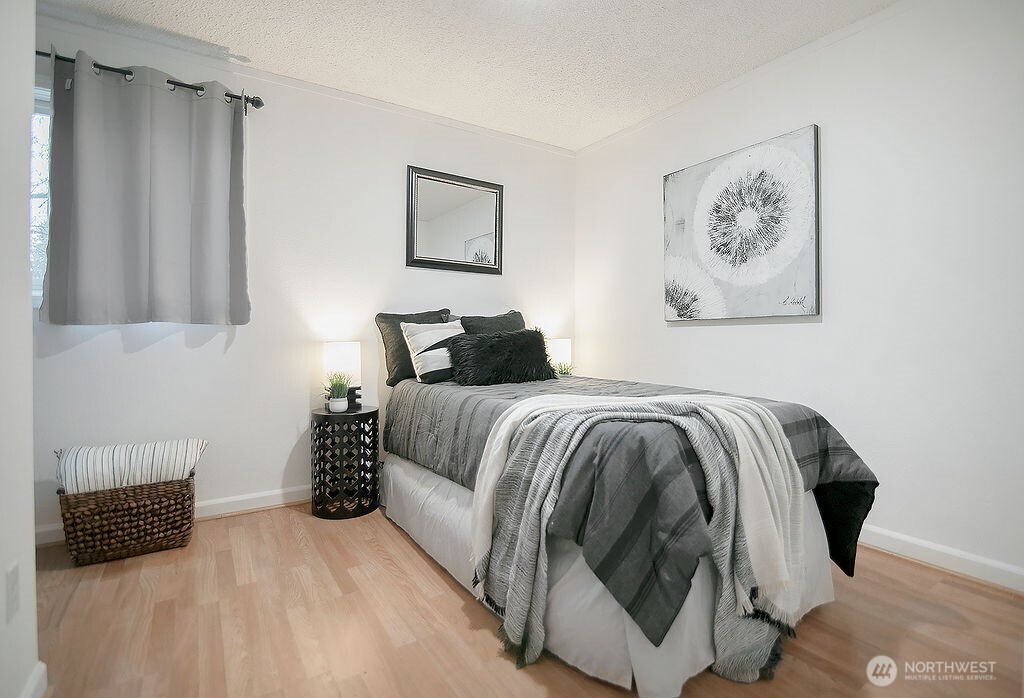 1925 28th Avenue Longview, WA 98632 - Photo 26 of 37 a bedroom with a bed and a painting on the wall