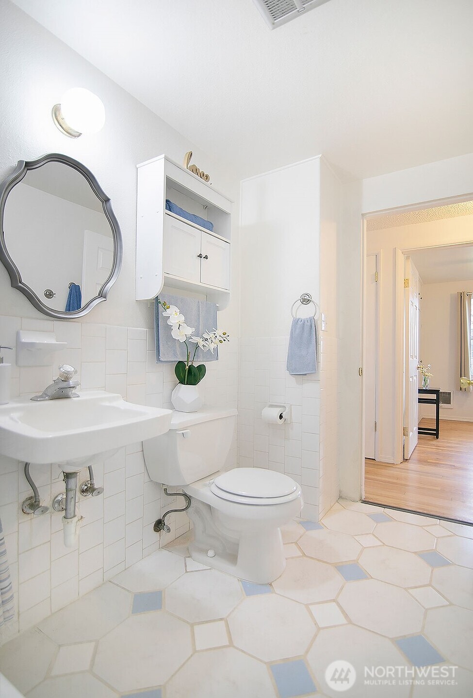 1925 28th Avenue Longview, WA 98632 - Photo 29 of 37 a bathroom with a sink a toilet a mirror and vanity