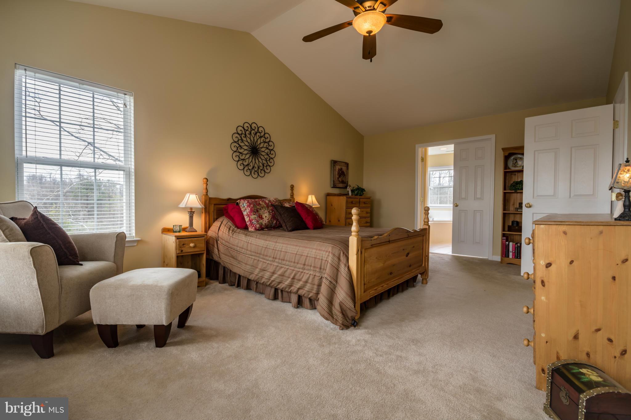 171 Wright Road Winchester, VA 22603 - Photo 17 of 30 a bedroom with a bed couch and window