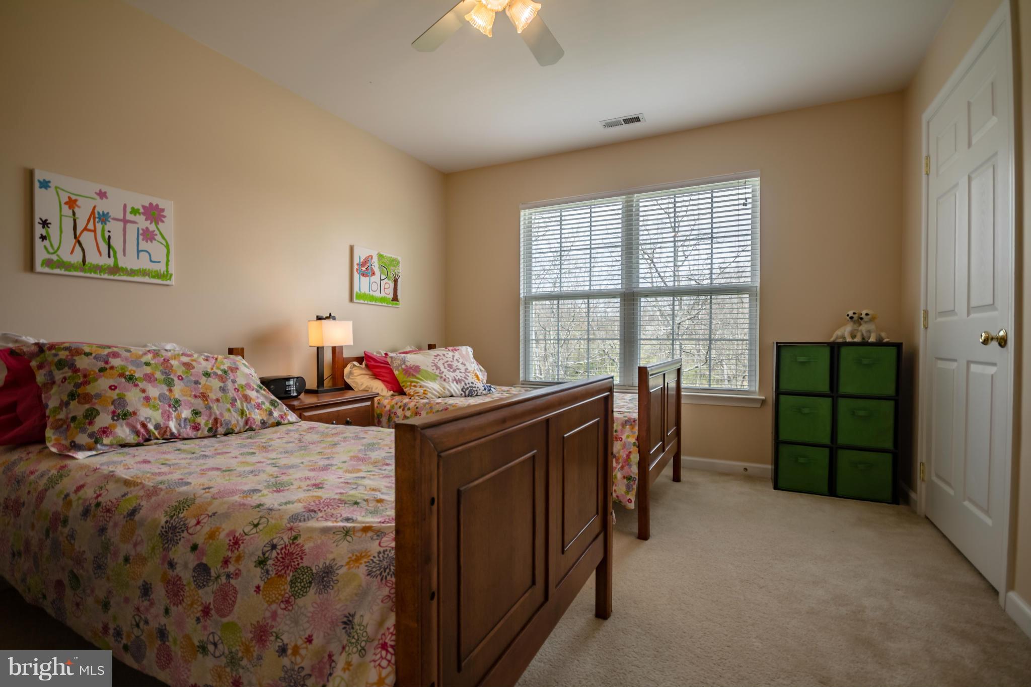 171 Wright Road Winchester, VA 22603 - Photo 22 of 30 a bed room with a bed and a chandelier