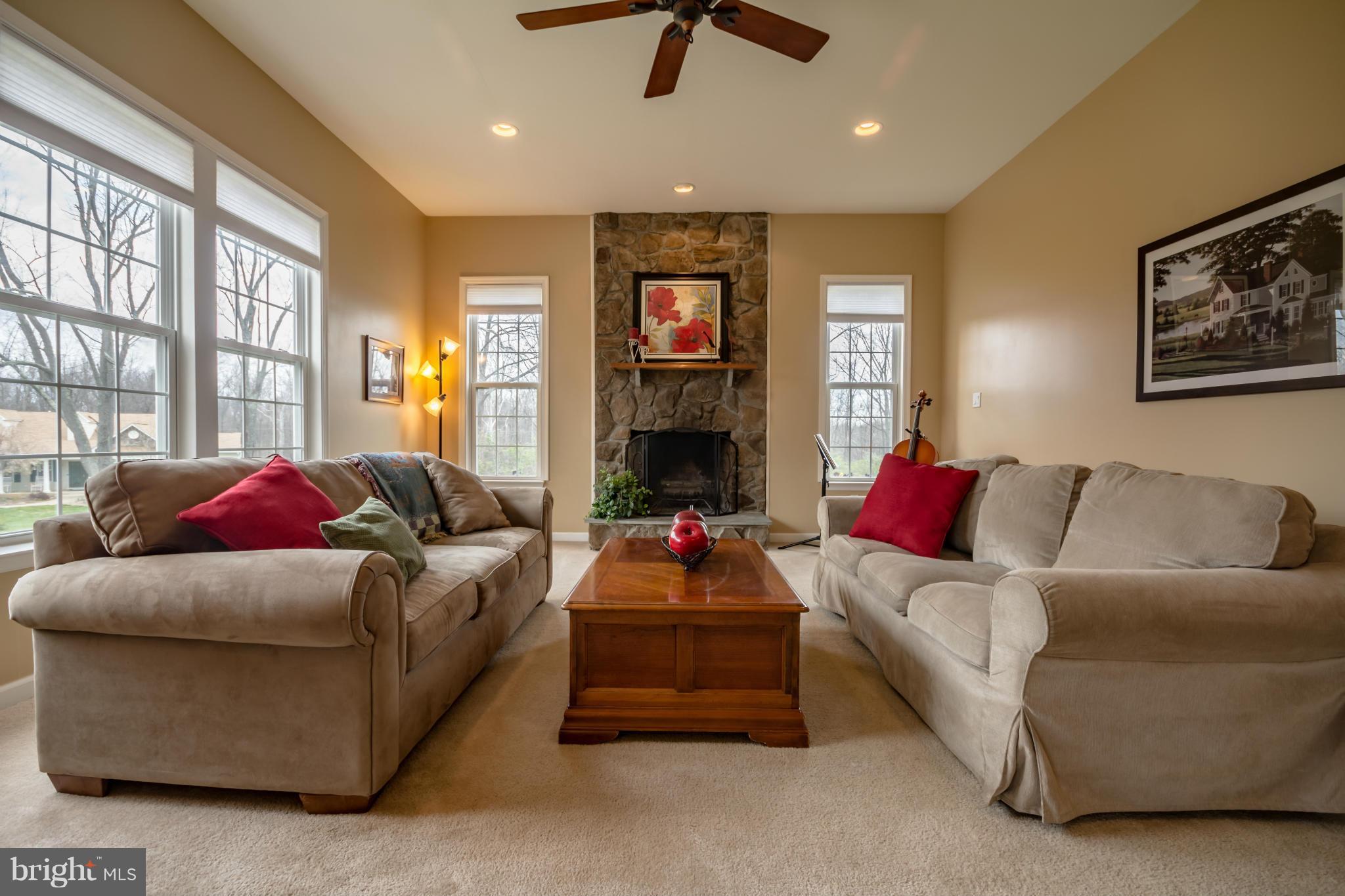 171 Wright Road Winchester, VA 22603 - Photo 6 of 30 a living room with furniture and a fireplace
