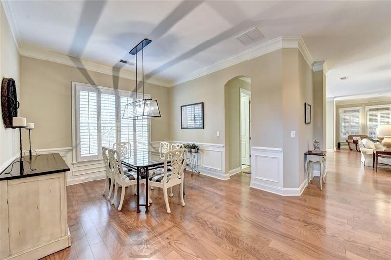 4865 Chase Lane Cumming, GA 30040 - Photo 12 of 70 a view of a dining room with furniture and wooden floor