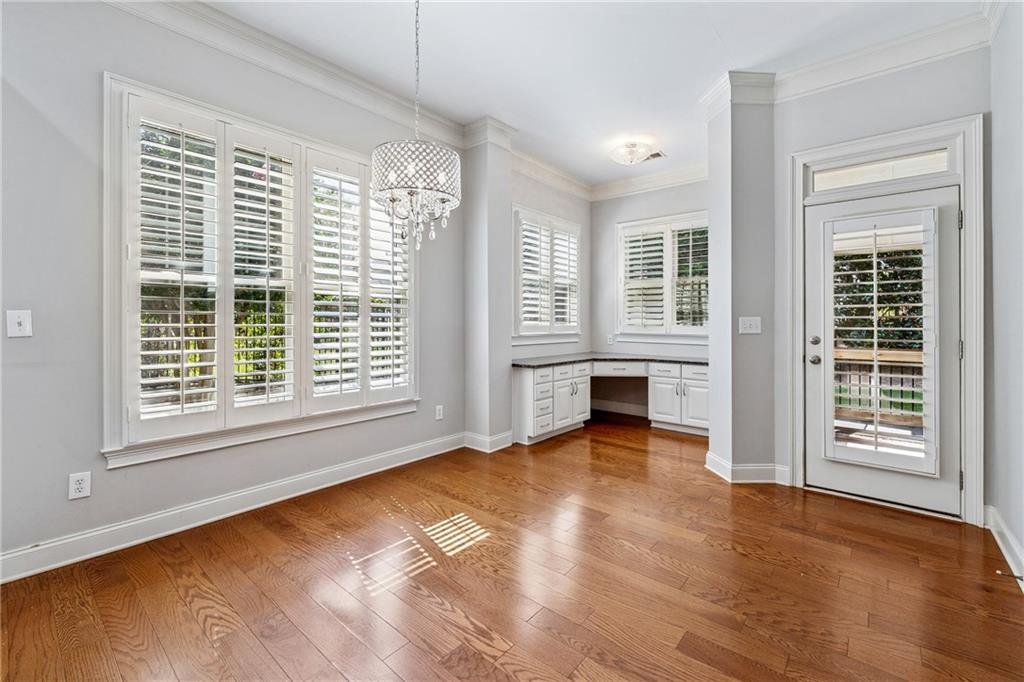 4865 Chase Lane Cumming, GA 30040 - Photo 17 of 70 a view of an empty room with a window and wooden floor