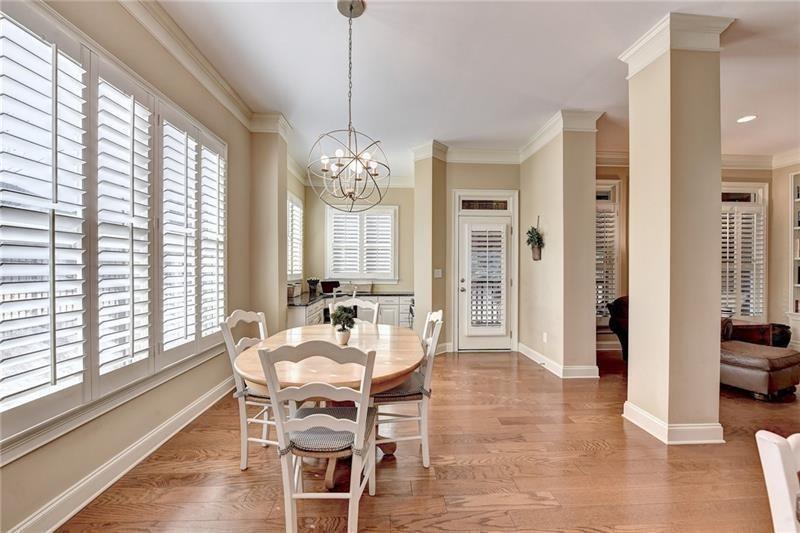 4865 Chase Lane Cumming, GA 30040 - Photo 18 of 70 a view of a dining room with furniture window and wooden floor