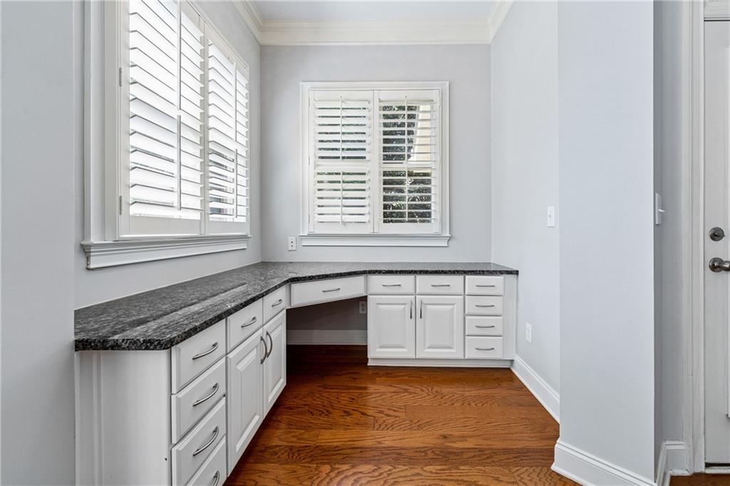 4865 Chase Lane Cumming, GA 30040 - Photo 19 of 70 a large white kitchen with granite countertop sink