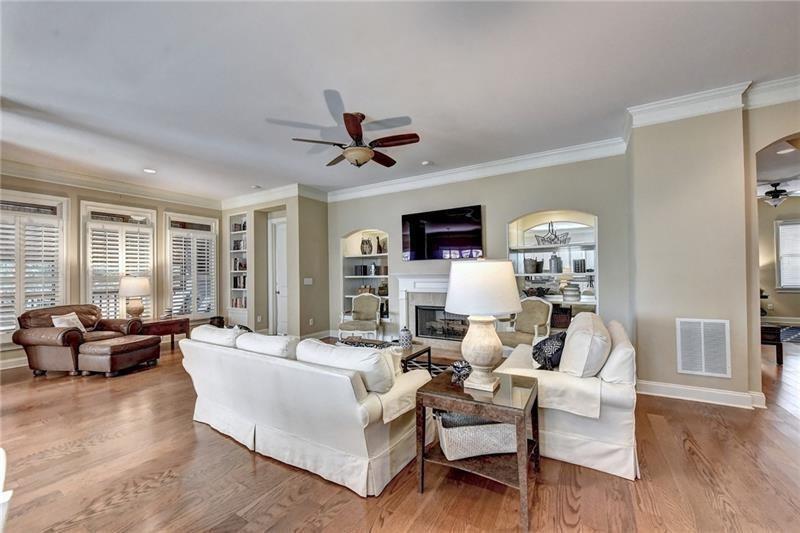 4865 Chase Lane Cumming, GA 30040 - Photo 24 of 70 a living room with furniture flat screen tv and large window