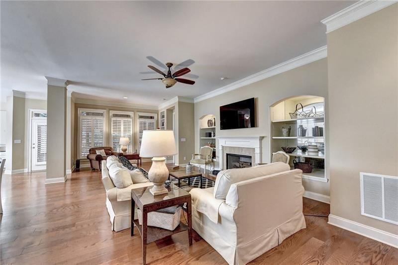 4865 Chase Lane Cumming, GA 30040 - Photo 25 of 70 a living room with fireplace furniture and a flat screen tv