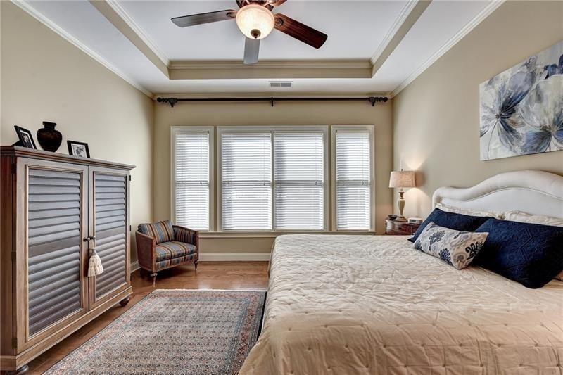 4865 Chase Lane Cumming, GA 30040 - Photo 30 of 70 a spacious bedroom with a bed and a window
