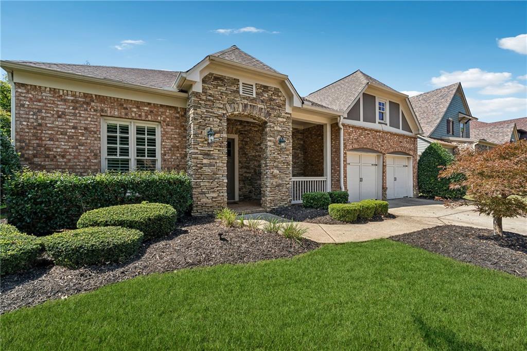 4865 Chase Lane Cumming, GA 30040 - Photo 3 of 70 a view of a front of a house with a yard