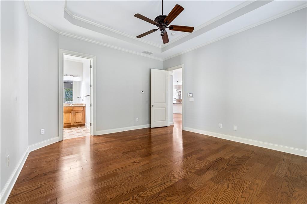 4865 Chase Lane Cumming, GA 30040 - Photo 32 of 70 a view of an empty room and wooden floor