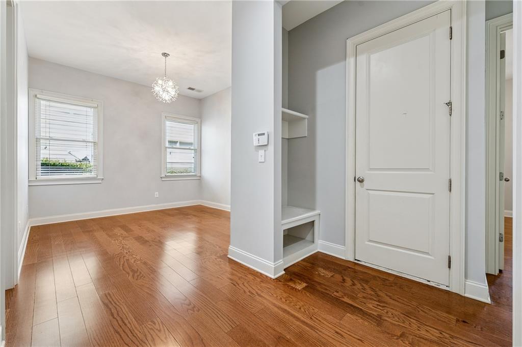 4865 Chase Lane Cumming, GA 30040 - Photo 37 of 70 an empty room with wooden floor and window