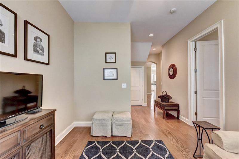 4865 Chase Lane Cumming, GA 30040 - Photo 39 of 70 a living room with furniture and a flat screen tv