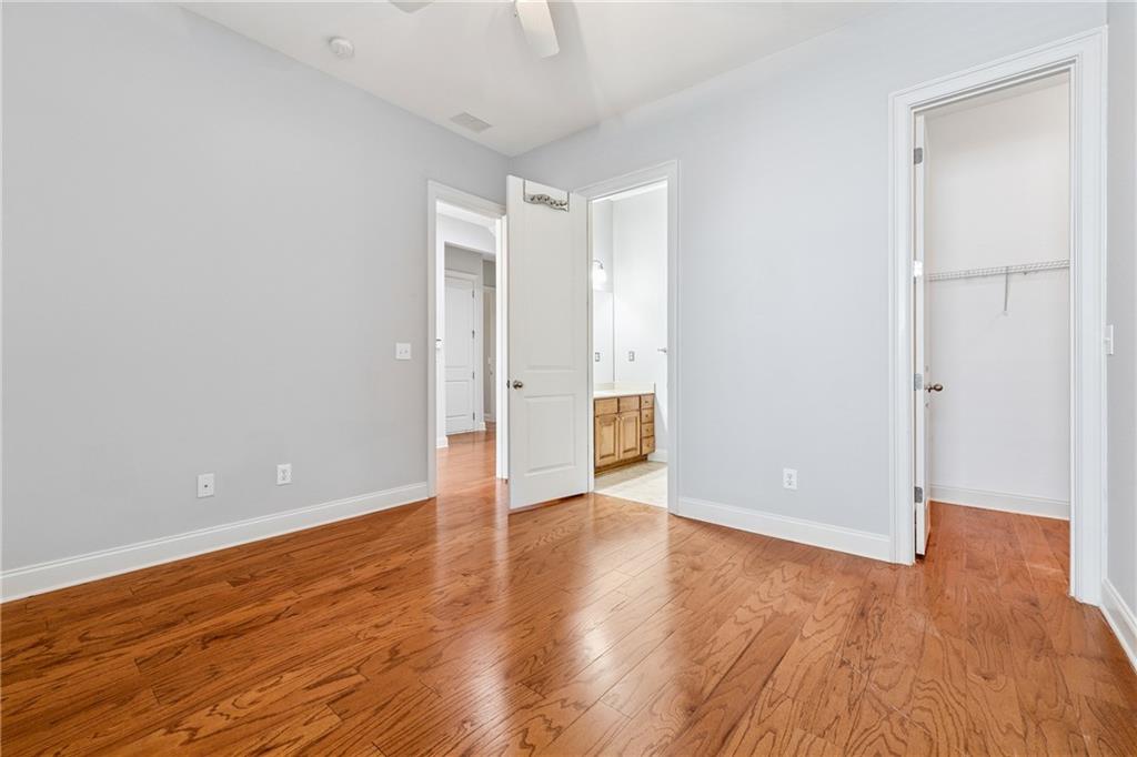 4865 Chase Lane Cumming, GA 30040 - Photo 41 of 70 a view of an empty room with wooden floor