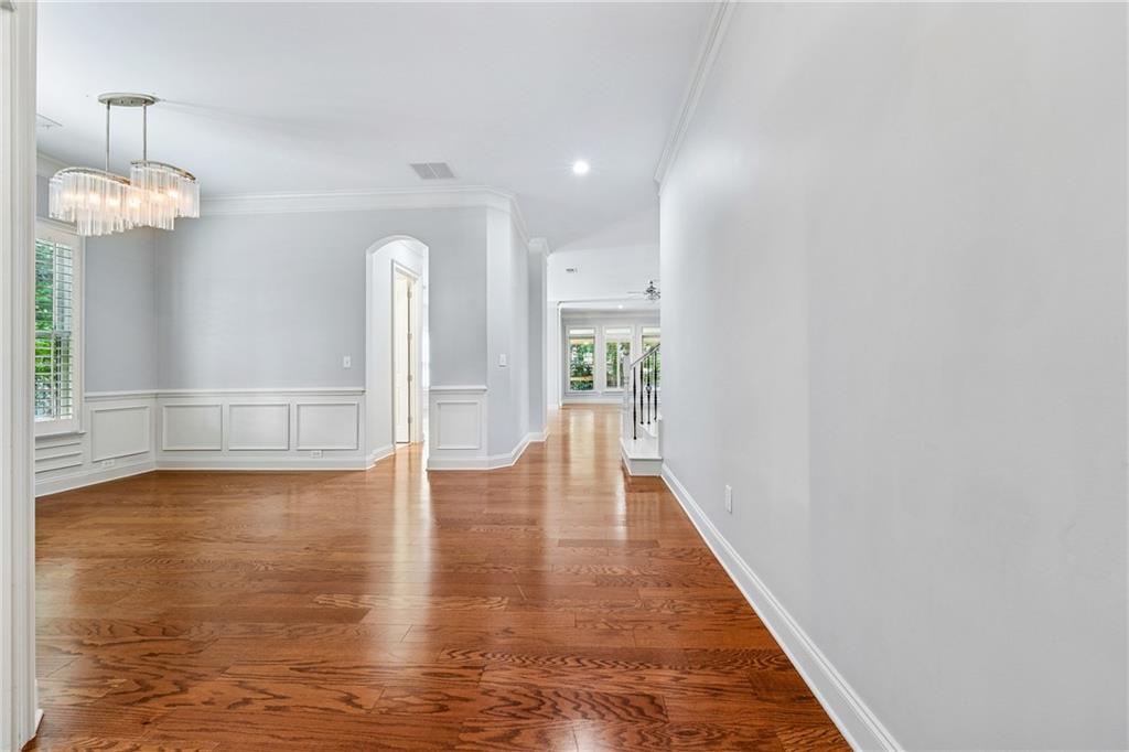 4865 Chase Lane Cumming, GA 30040 - Photo 5 of 70 wooden floor in an empty room with a window