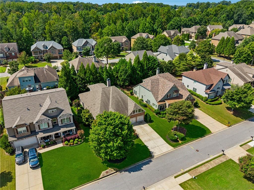4865 Chase Lane Cumming, GA 30040 - Photo 58 of 70 an aerial view of a house with garden space and street view